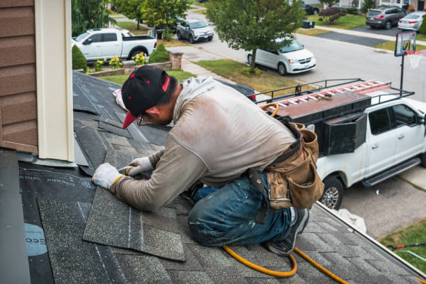 Professional Roof Replacement technician working in Elwood, NJ